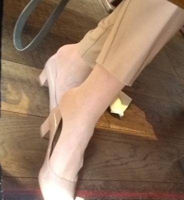 Nude nylon patent heels dangle