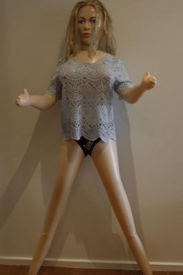 Sexy love doll wears a see through blue top