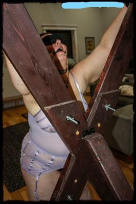 chained on the cross used by a Master and his slave