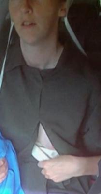 Amish Woman Breastfeeding Brown Dress