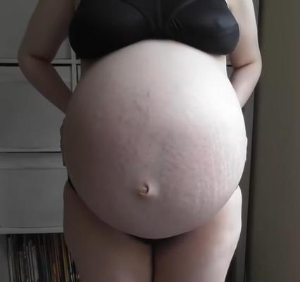 Non nude huge pregnant belly
